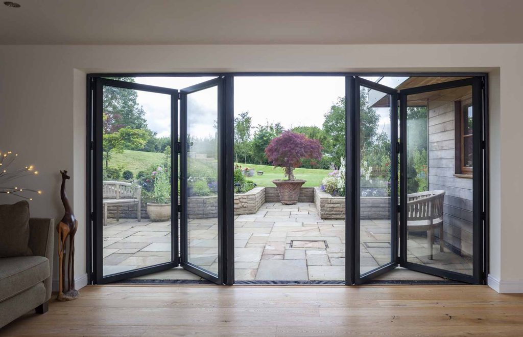 Bifold doors opening onto a stone garden