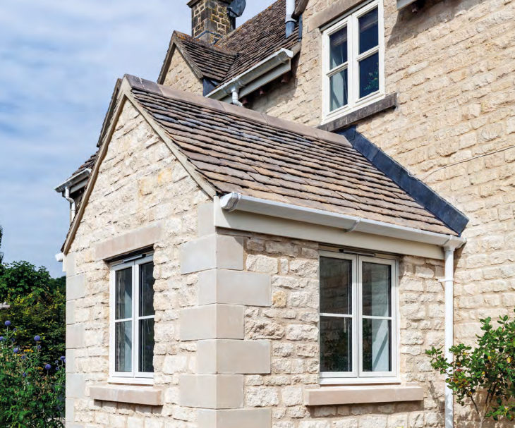 White flush Casement Windows on a white brick home
