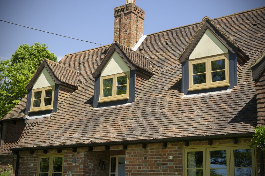 Timber coloured residence 9 Windows on a brick house